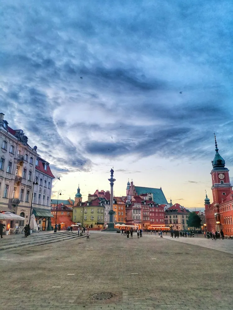 Historic square and clock tower in Warsaw Old Town, Poland.