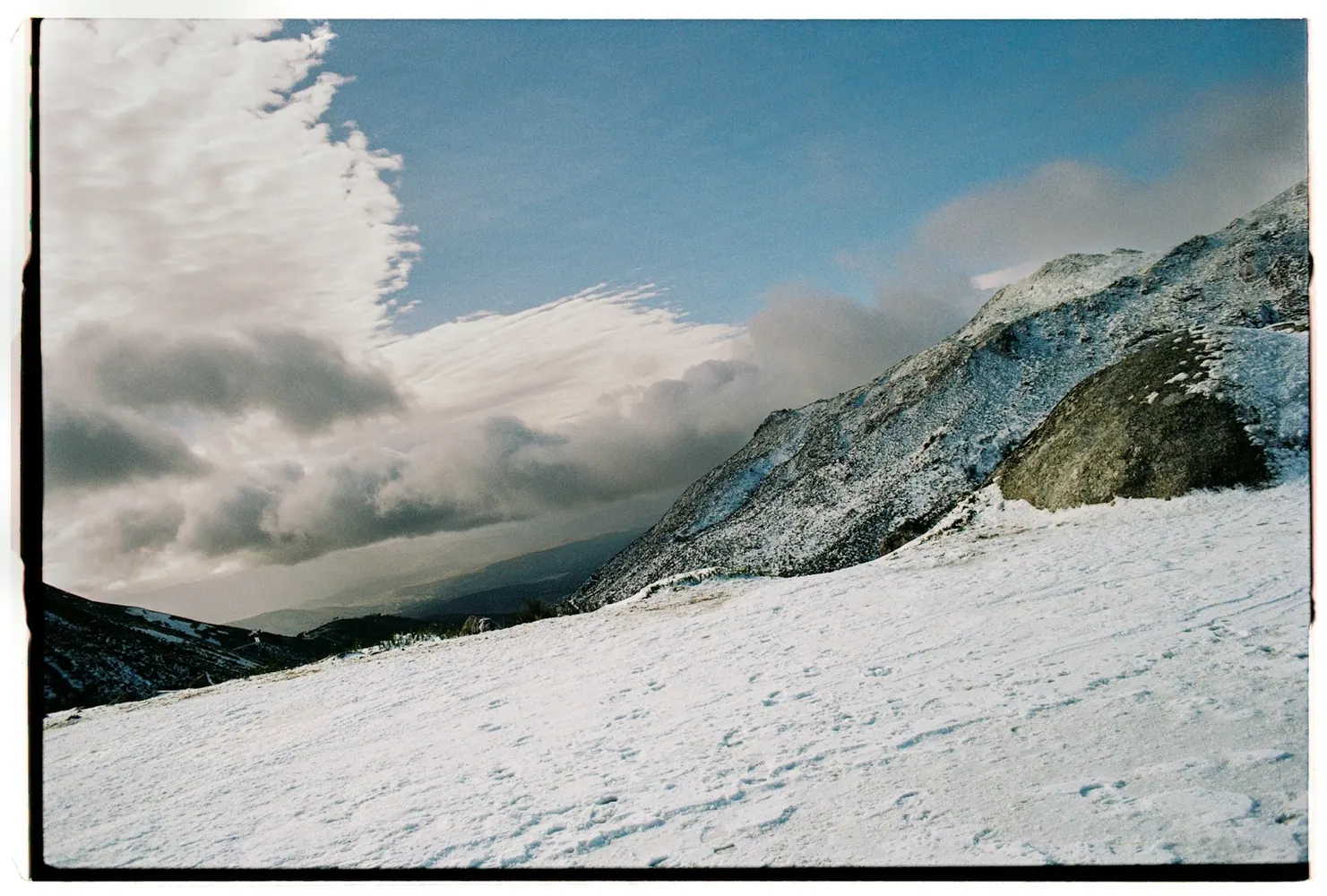 Snow-covered mountain landscape in Serra da Estrela, Portugal.