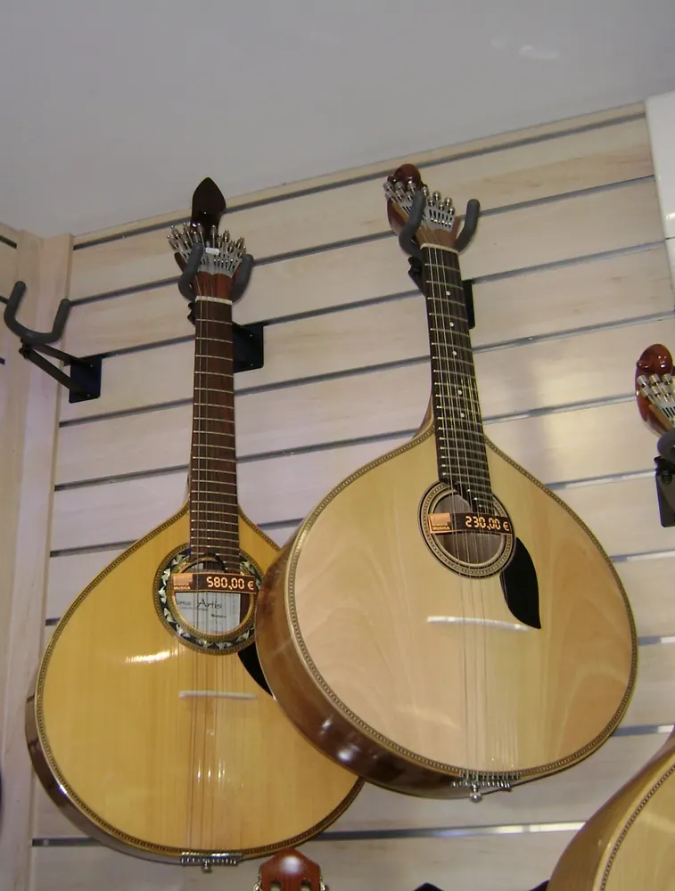 Coimbra and Lisbon styles of Portuguese guitar displayed side by side.