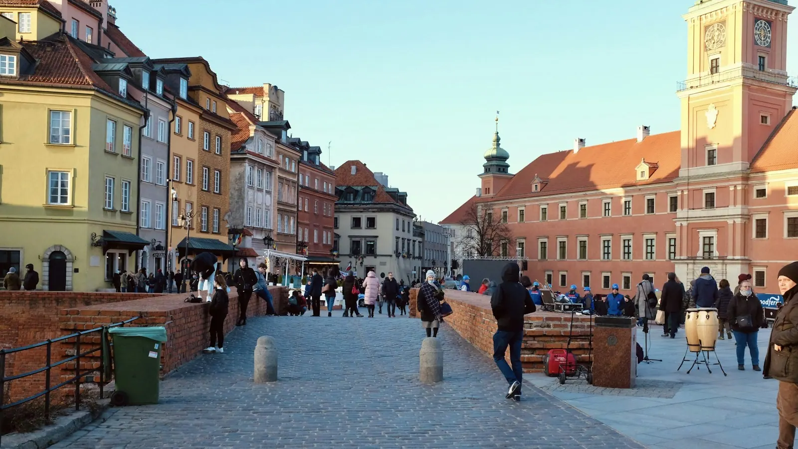 People walking through Castle Square in Warsaw, Poland. Destination context, not a photograph of this tour.