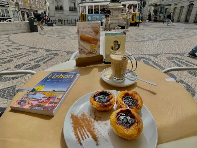 Pastel de nata displayed inside the historic Confeitaria Nacional.