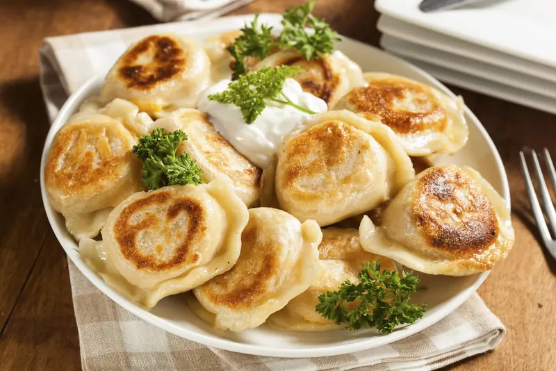 A variety of traditional Polish dishes on a table in Warsaw, showcasing local cuisine and rich culinary culture.