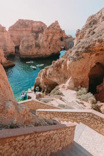 Springtime in the Algarve: A breathtaking mix of blooming wildflowers, golden beaches, scenic coastal cliffs, charming historic towns, delicious seafood, and lively local festivals, all under warm sunny skies.