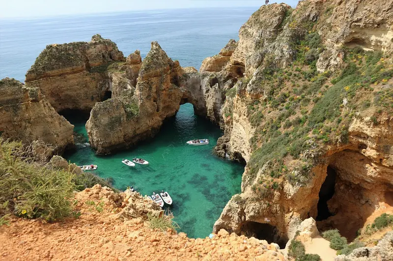 Eye-level view of Ponta da Piedade cliffs with turquoise waters