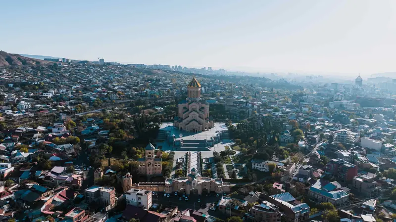 Why visit Tbilisi? Panoramic view of Georgia's capital showing the unique blend of European and Asian architecture, culture, and local life.