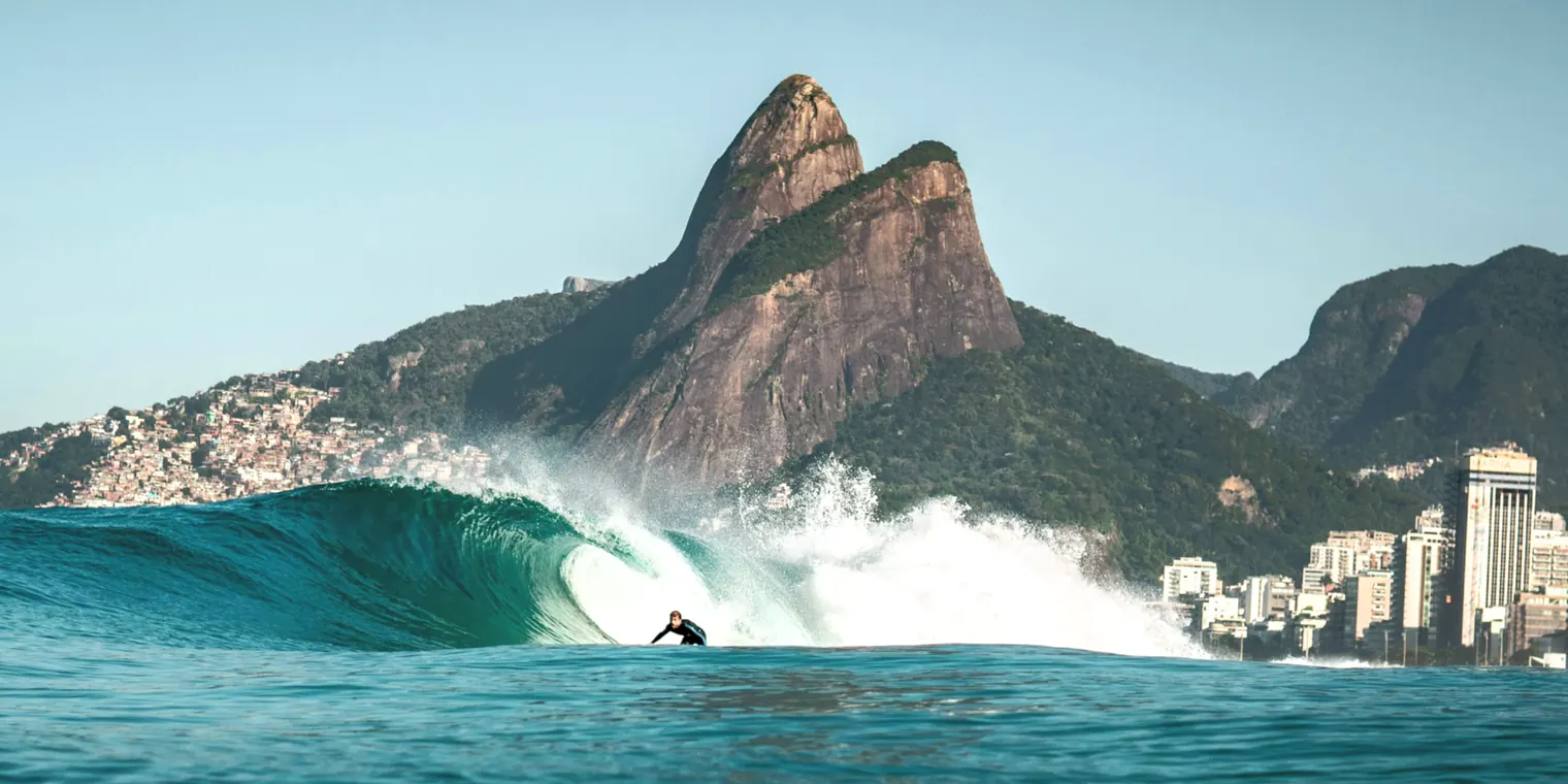 A guy surfing at Arpoador