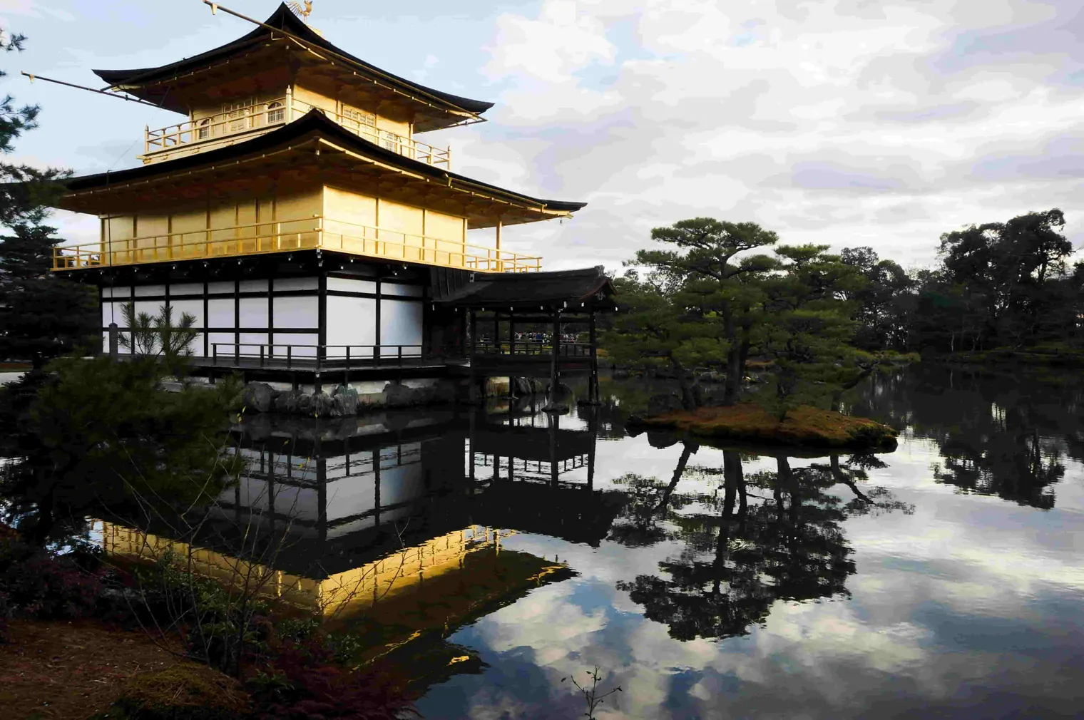 japanese temple next to a lake