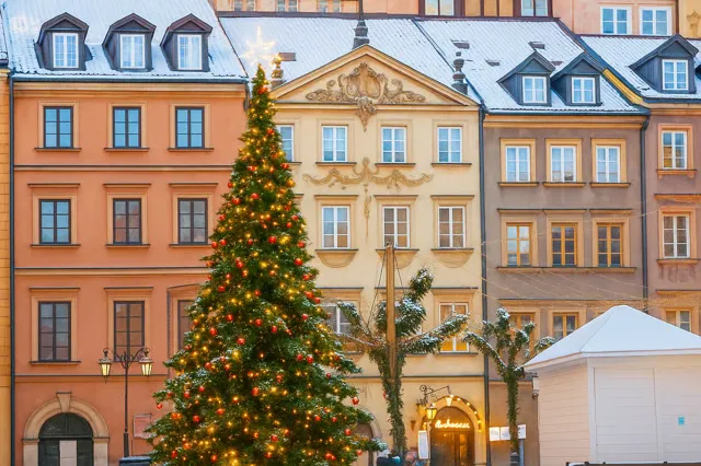 An illuminated Christmas tree in Warsaw Old Town.